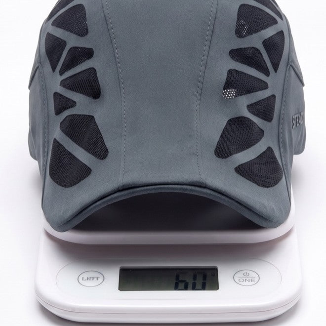 The Aeromesh Evo Cap on a kitchen scale reading 60 g